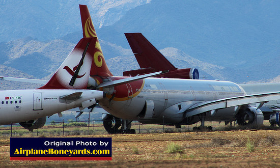 Phoenix Goodyear Airport aircraft storage facility and boneyard, with Airbus A321-200, TC-FBT, to the left