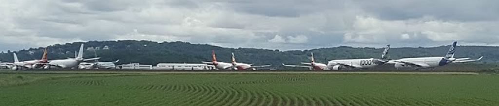 Panoramic view of airliners in storage at the TARMAC Aerosave Facility at the Tarbes–Lourdes–Pyrénées Airport
